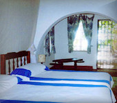 Jinchini House slaapkamer interieur, Msambweni Beach in Kenya